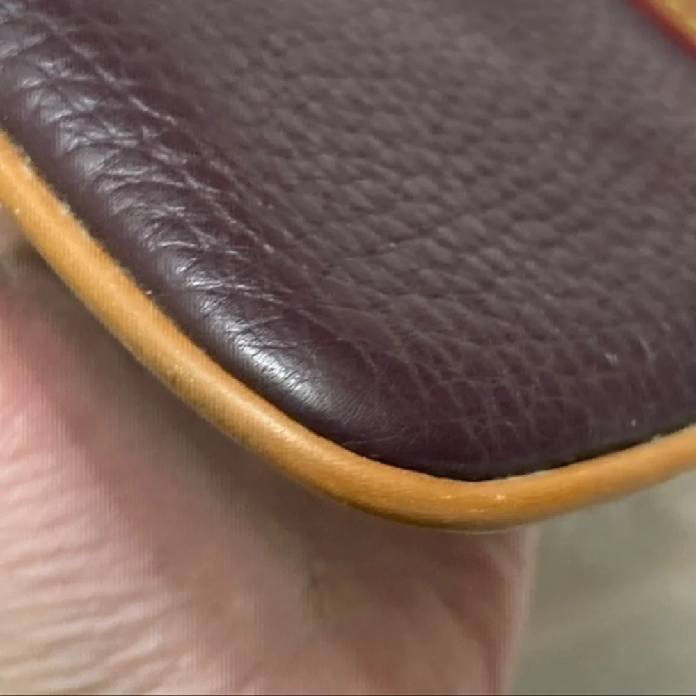 Dooney & Bourke purple and brown leather cosmetic bag